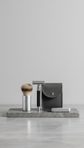 A compact travel shaving kit, featuring high-quality materials and a minimalist design, is centered on a smooth, natural...