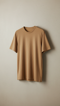A men's t-shirt made from bamboo and organic cotton in Sand Dune hue is perfectly centered against a neutral textured...
